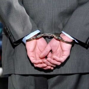 An experienced federal criminal defense lawyer in San Diego reviewing a case file for a client facing federal drug trafficking or money laundering charges