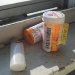 A San Diego prescription drug defense lawyer reviewing medical records to fight fraud and possession charges