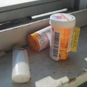 A San Diego prescription drug defense lawyer reviewing medical records to fight fraud and possession charges